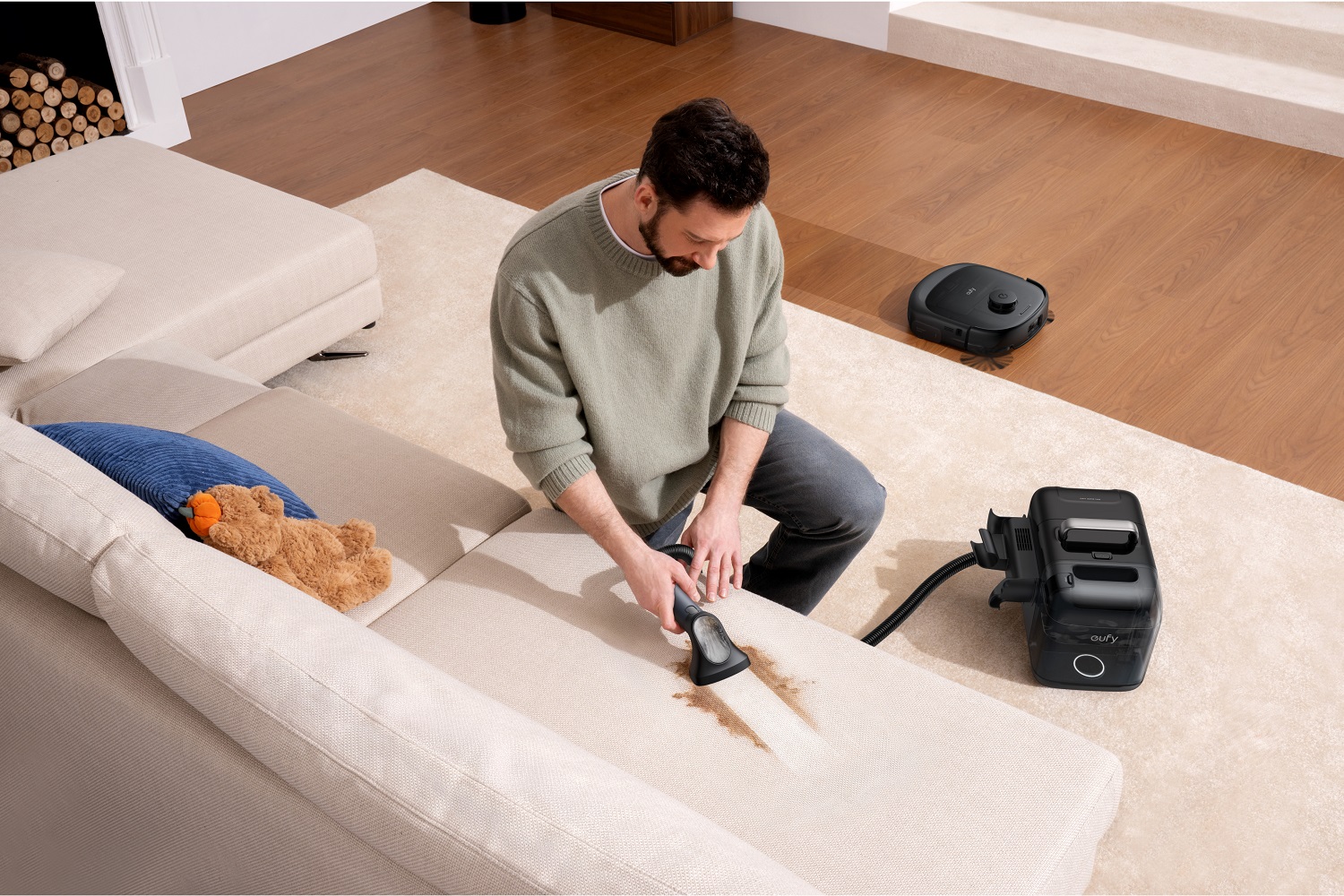 Anker 2025 Innovation Showcase: Smart Tech to Power Your Life 6 A man using the Eufy Omni E28 Robot Vacuum.