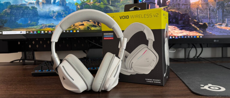 Corsair VOID Wireless V2 on a desk in front of two monitors and a keyboard