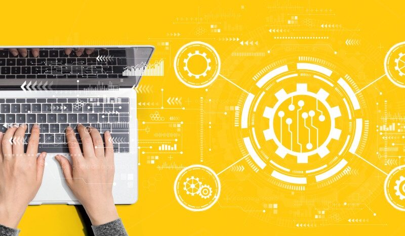 Automation concept with person using a laptop computer