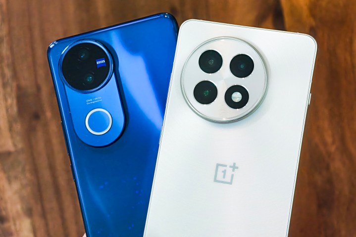 I’ve tested the best camera phone for $400 9 Vivo V50 celestial blue and OnePlus 13R in white held in hand.