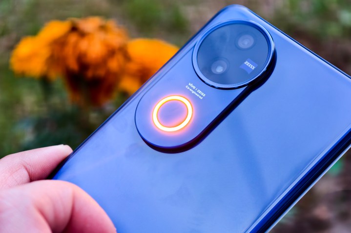 I’ve tested the best camera phone for $400 7 Vivo V50 celestial blue with Aura Light held in hand.
