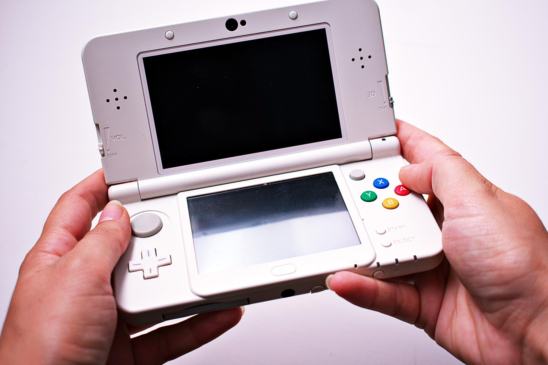 Beyond the Hype: The Real Best-Selling Games on Every Console 13 Person holding Nintendo 3DS in hands