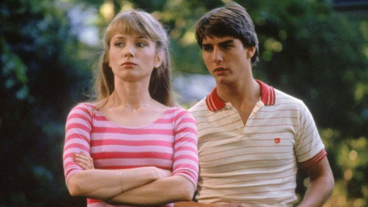 A male and female stand with each other in a risky business.
